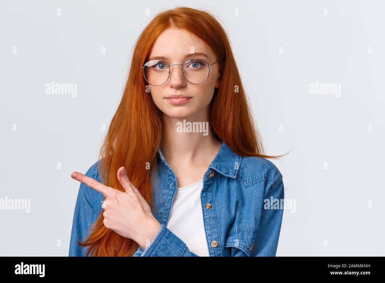 Close-up portrait serious smart and determined young redhead female making  strong final choice, pointing finger left and looking camera confident  Stock Photo - Alamy