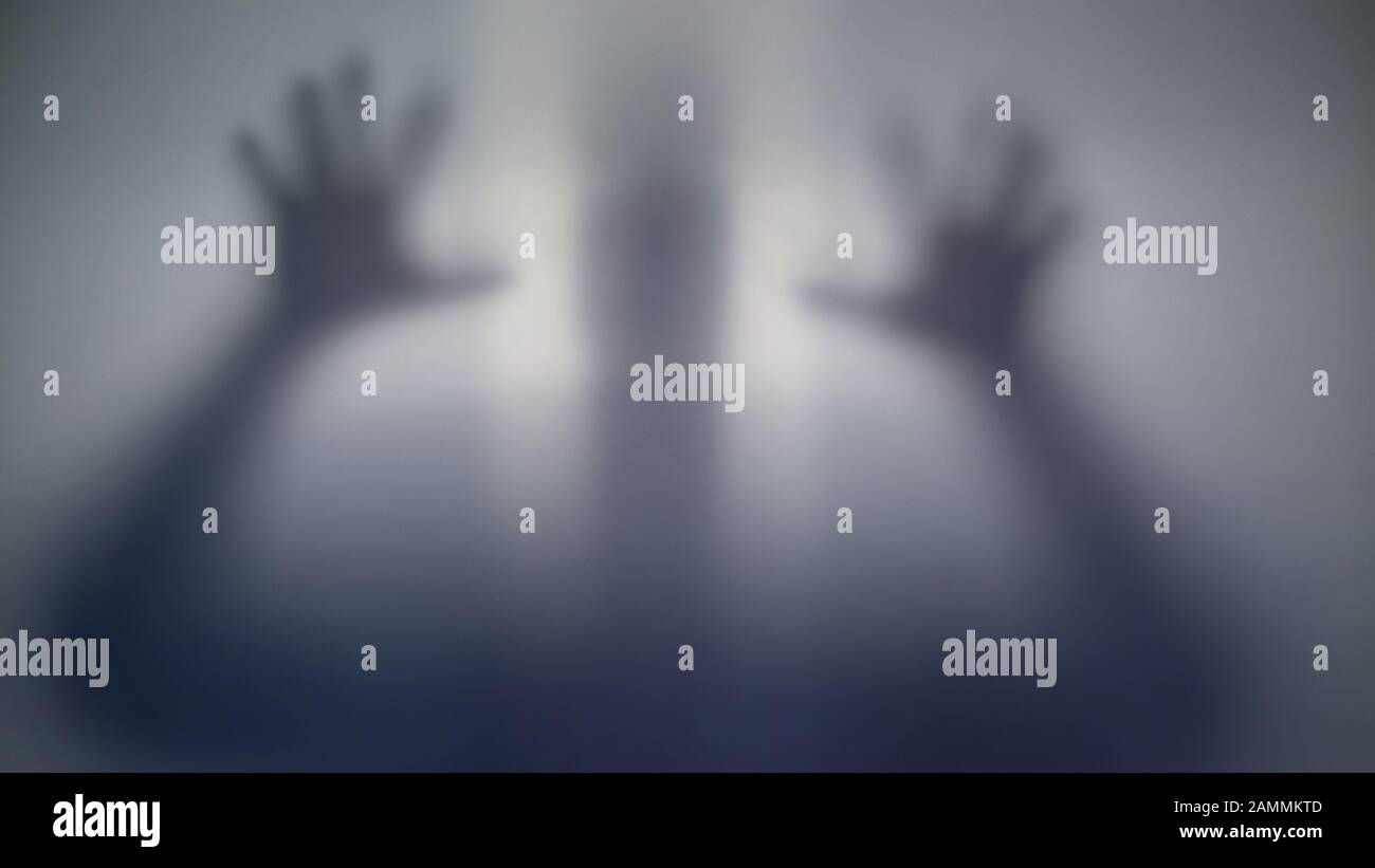Horrible silhouette behind film, scary supernatural alien, strange creature Stock Photo