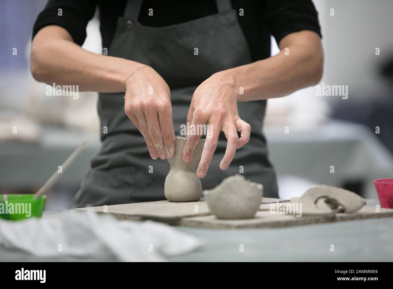 Pottery course for adults with an art teacher in the ceramics in the children's art