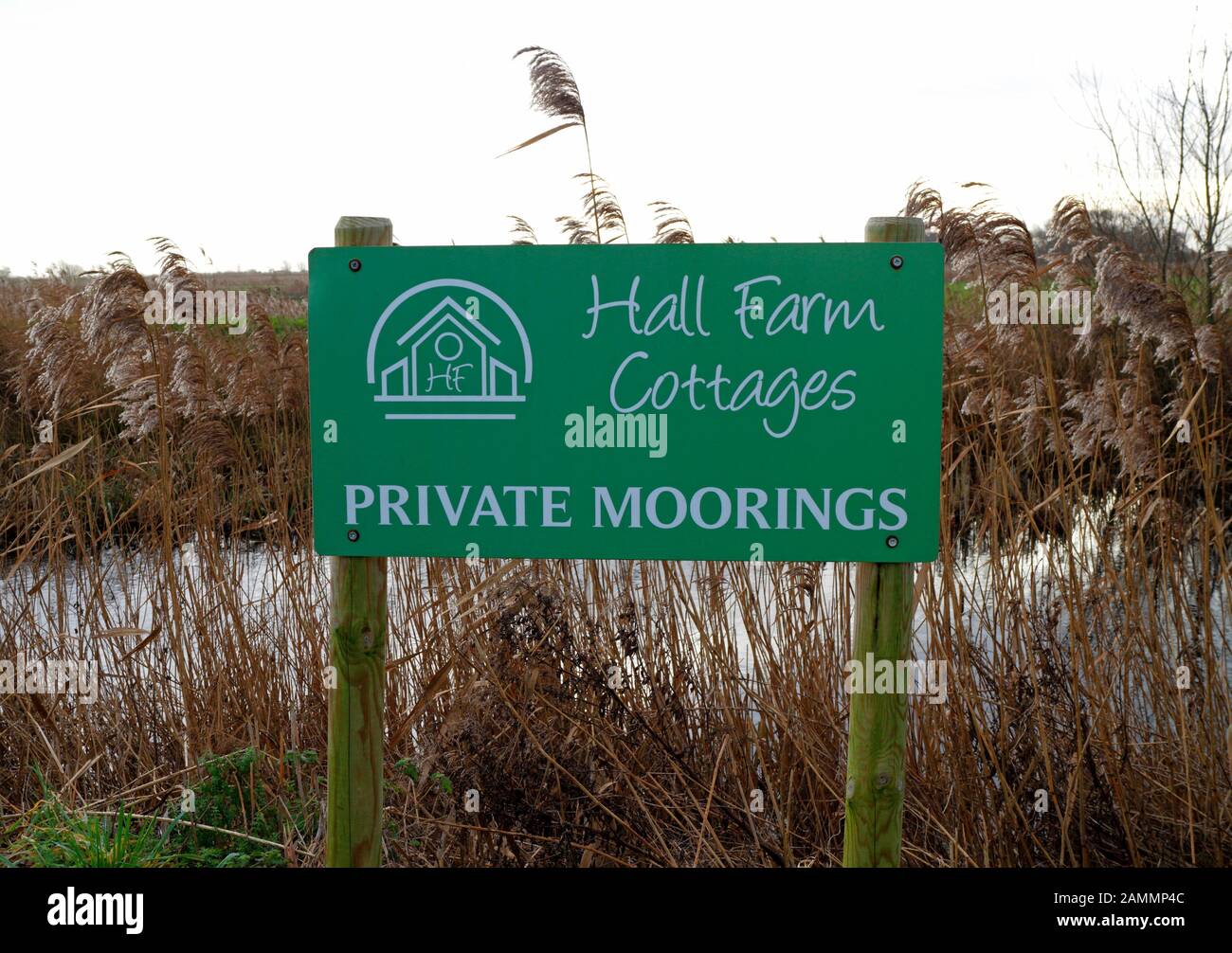 A Private Moorings sign by the River Ant on the Norfolk Broads at Ludham, Norfolk, England, United Kingdom, Europe. Stock Photo