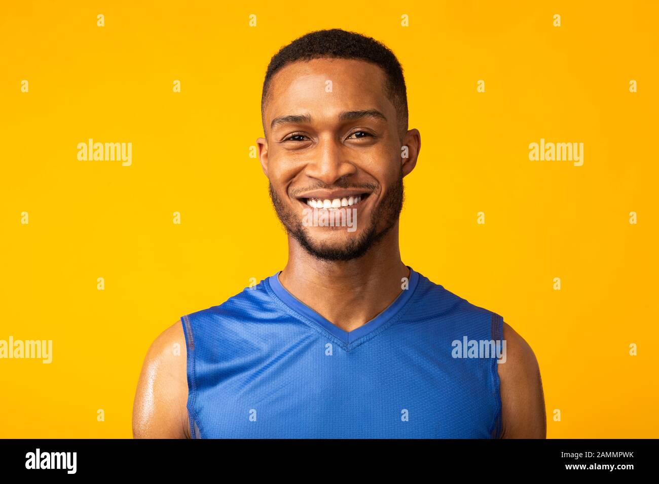 Front view portrait of smiling happy afro sportsman Stock Photo