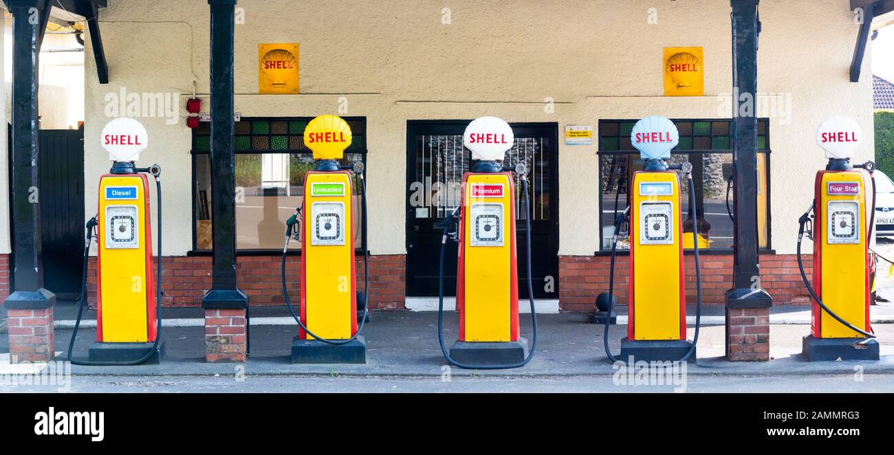 The Grade II listed Colyford Filling Station was built in 1927/28 and now features five 1950s vintage Avery Hardoll Pumps in Shell livery. Stock Photo