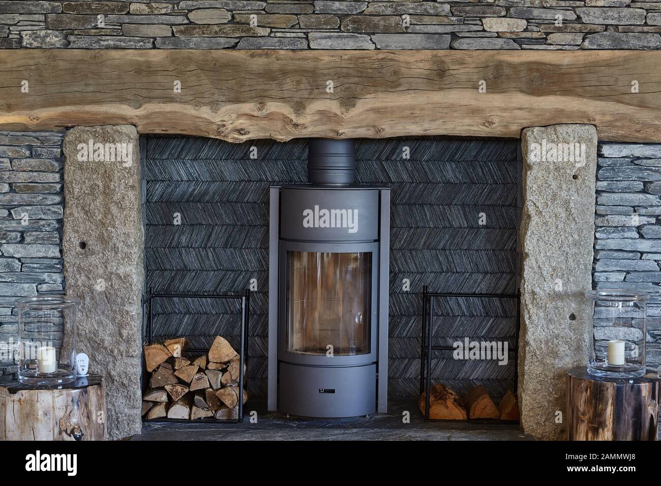 wood burner in slate fireplace Stock Photo
