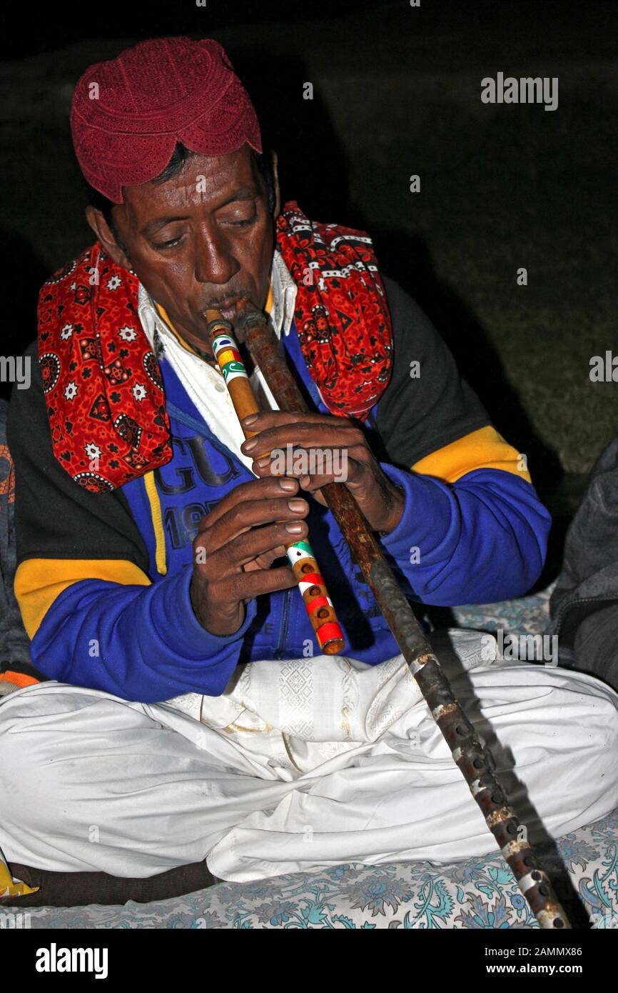 Gujarati Musician playing Algoze - pair wooden recorders Stock Photo