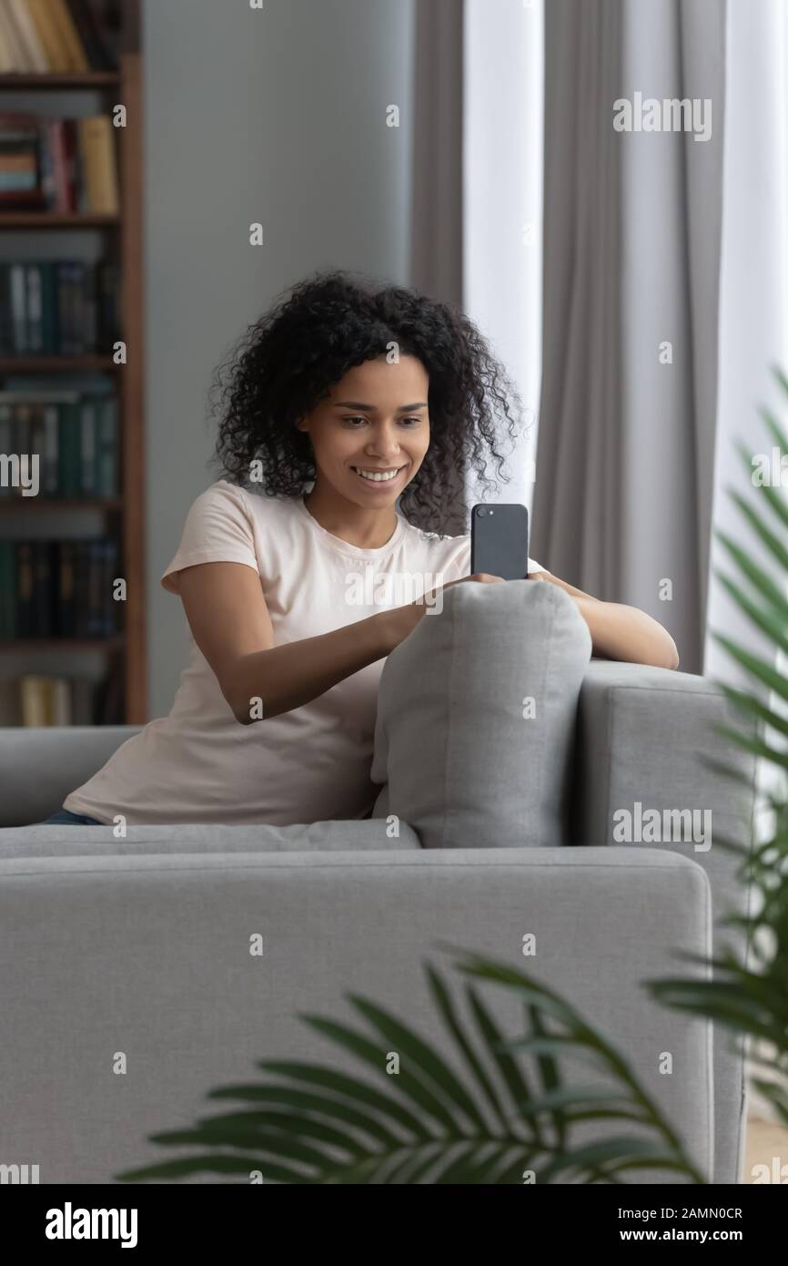 African woman sitting hi-res stock photography and images - Alamy