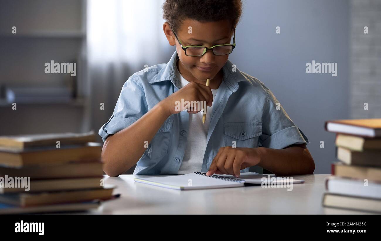 Boy with disability to learn reading and writing skills trying to concentrate Stock Photo Alamy