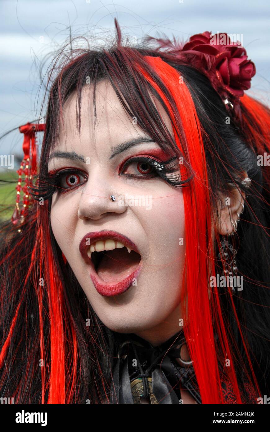 Boy Wearing Fake Vampire Teeth With Fangs High-Res Stock Photo