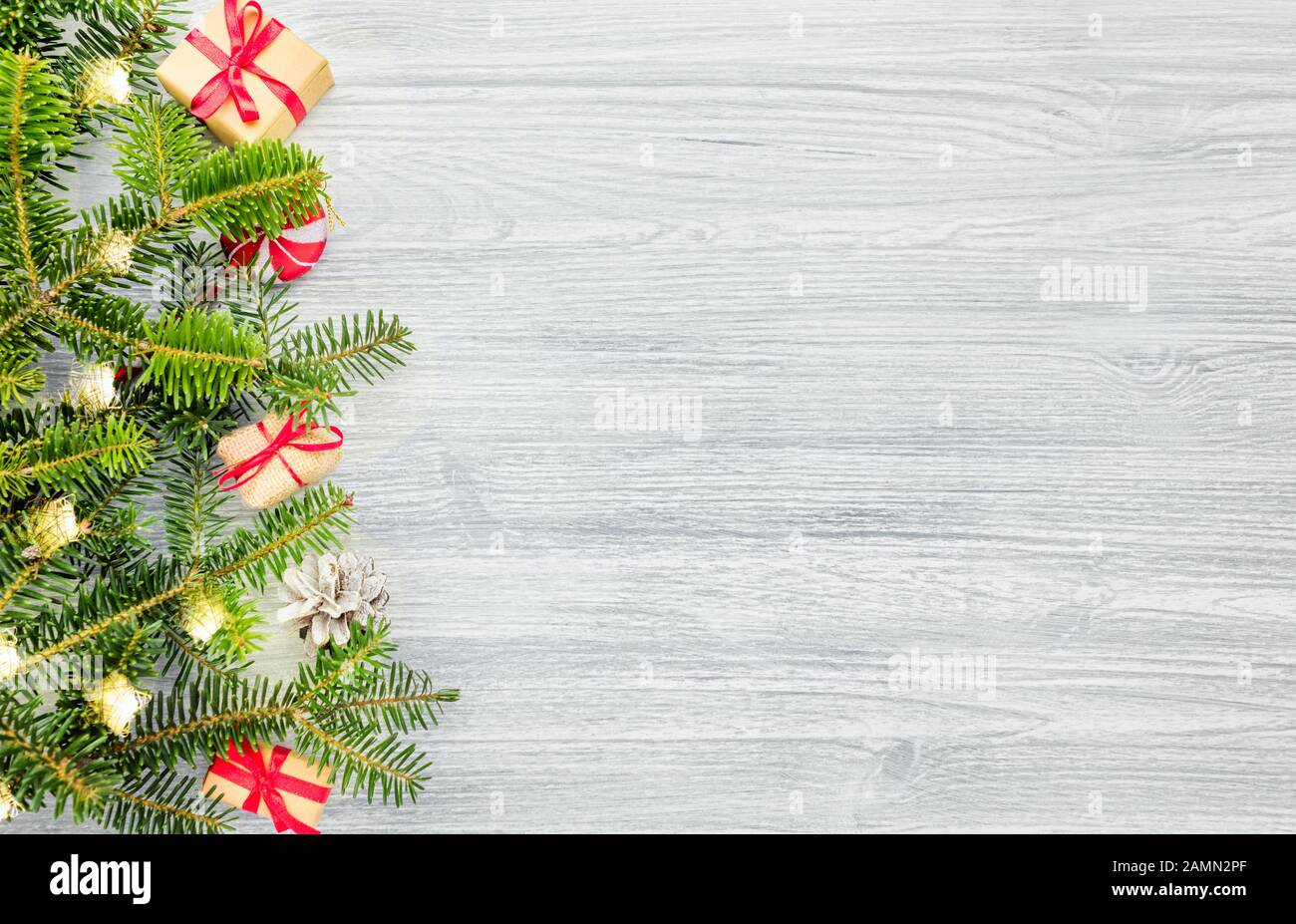 Christmas fir tree on a wooden background Stock Photo
