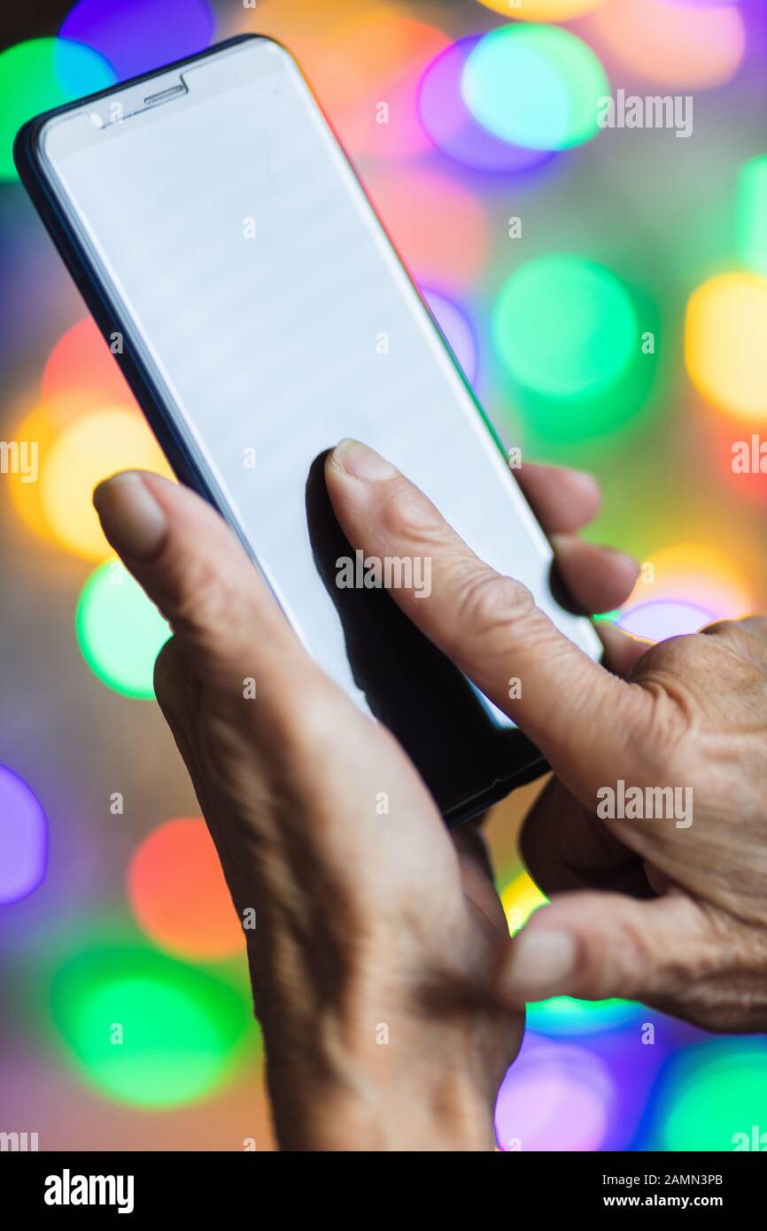Closeup on elderly woman using he smart phone Stock Photo