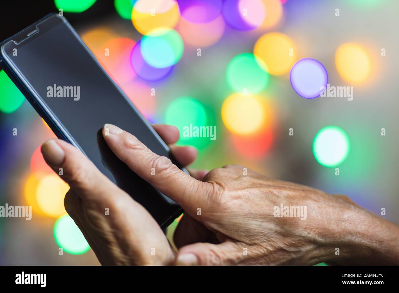 Closeup on elderly woman using he smart phone Stock Photo