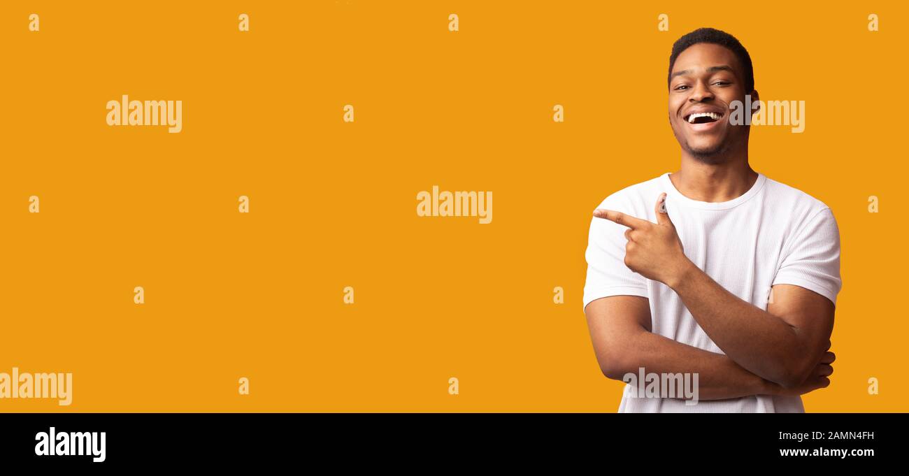 African american man pointing aside at empty space Stock Photo