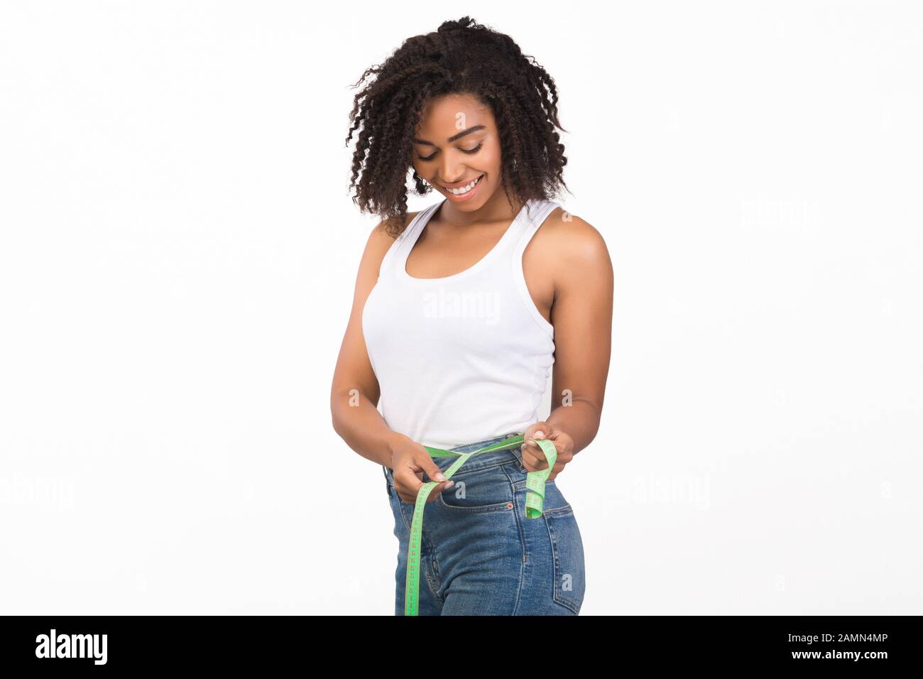 https://c8.alamy.com/comp/2AMN4MP/portrait-of-happy-young-black-woman-with-measuring-tape-2AMN4MP.jpg