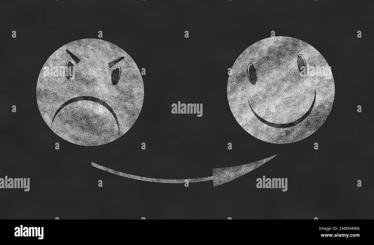 Angry emoticon, smiley face isolated on black background Stock Photo