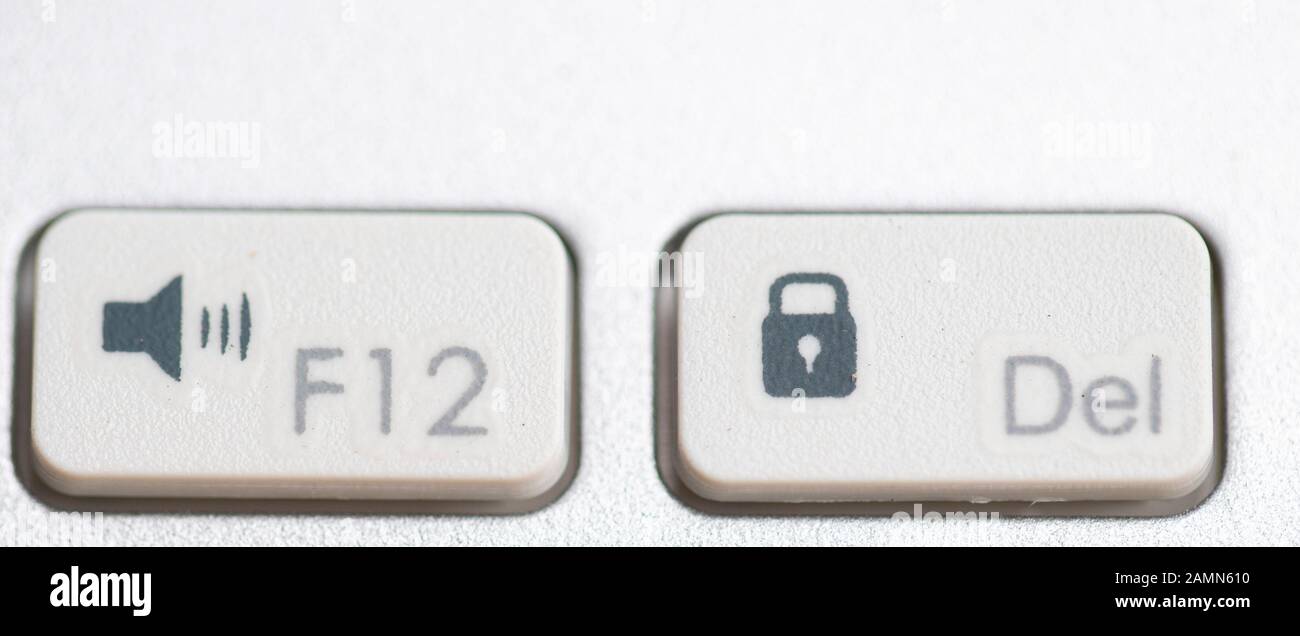 two buttons close up computer white keyboard, function, F12 function and Del button use for operation program control Stock Photo