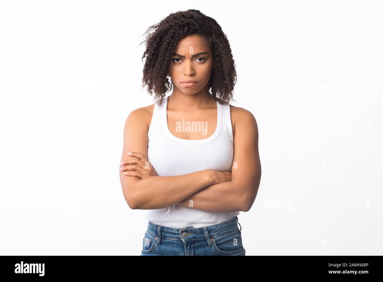 Closeup of frustrated afro girl with folded arms Stock Photo