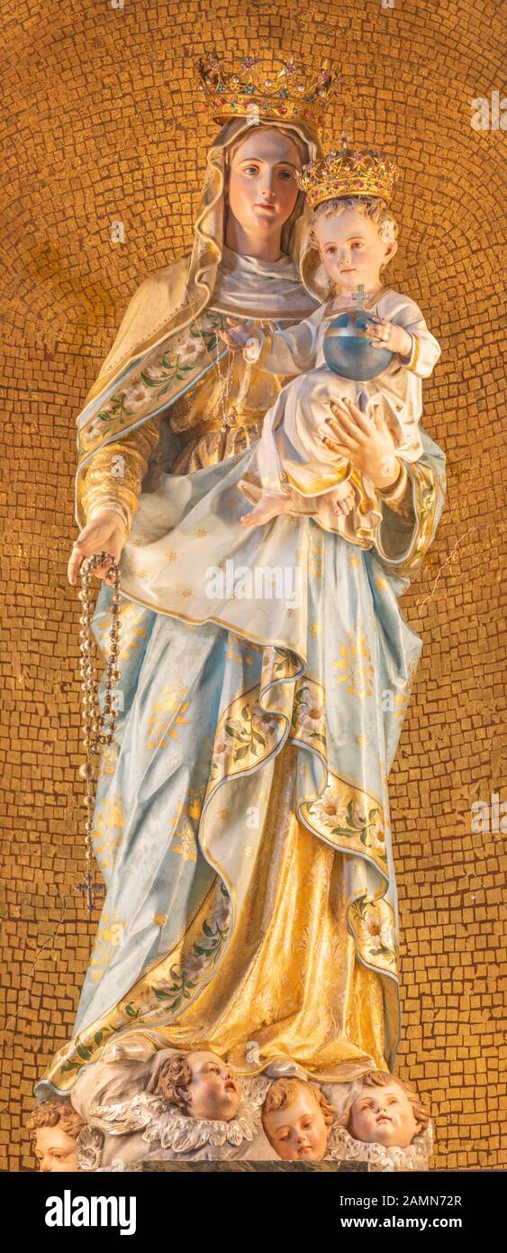 MENAGGIO, ITALY - MAY 8, 2015: The carved polychrome statue of Madonna church chiesa di Santo Stefano by Luigi Tagliaferri (1841-1927). Stock Photo
