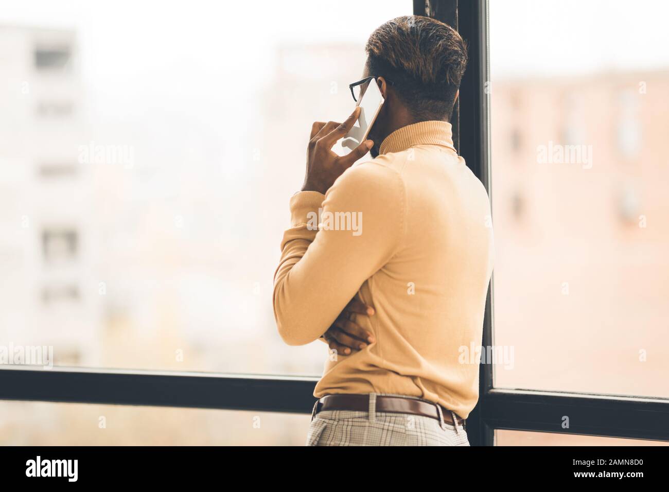 Unrecognizable afro man talking on the phone Stock Photo
