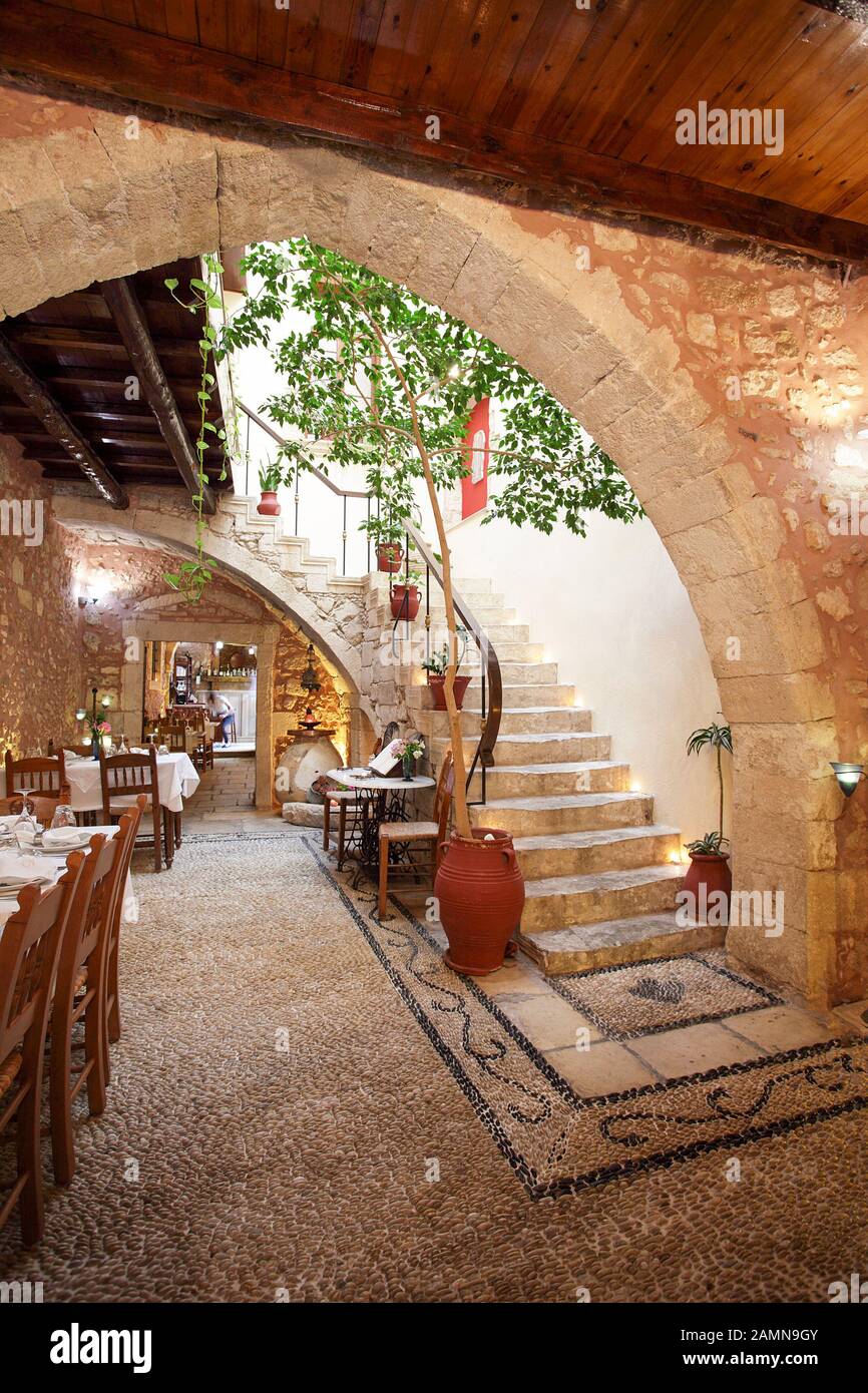 An internal view of the main reception area of Veneto Restaurant in Rethymnon, forming just one part of this 14th century old monastery. Stock Photo