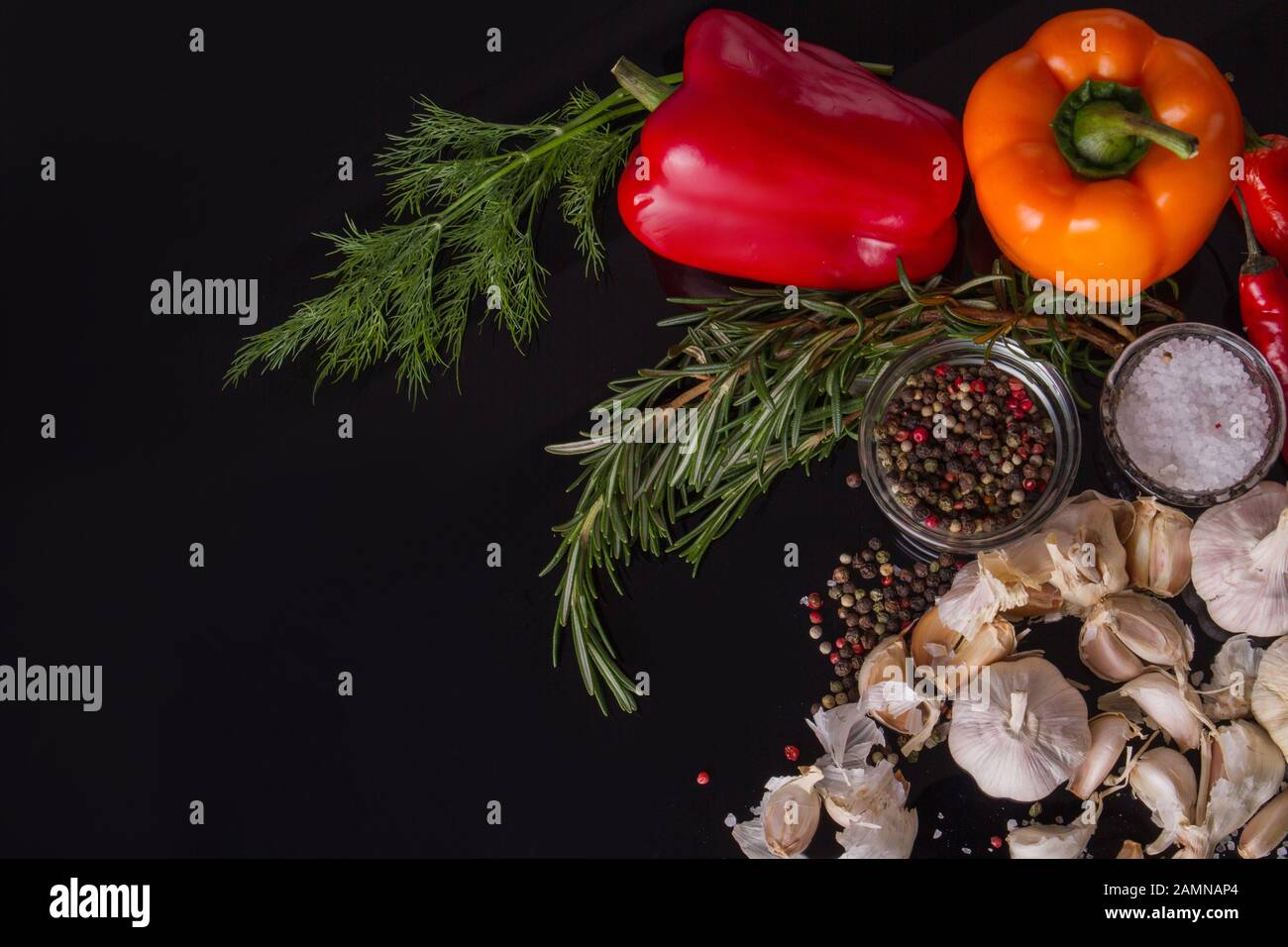 Herbs and multi-colour peppers. Stock Photo