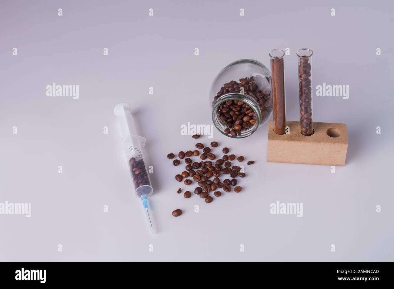Coffee beans in test tubes and syringe Stock Photo Alamy