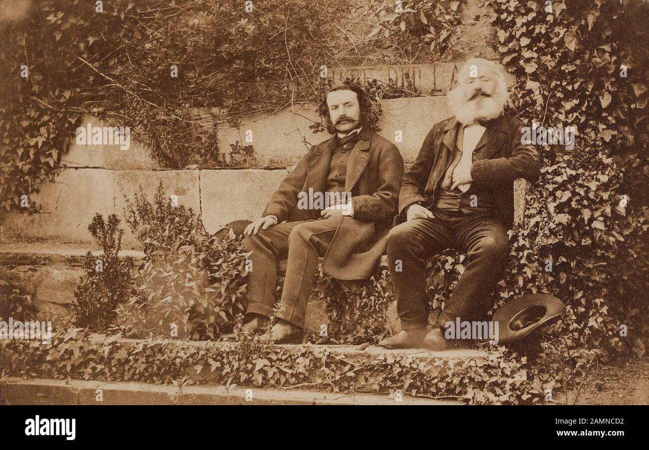 Belsham Hutton, Thomas , Portrait of Victor Hugo and his son François-Victor, sitting in the garden of Hauteville House , between 1861 - 1863 Stock Photo