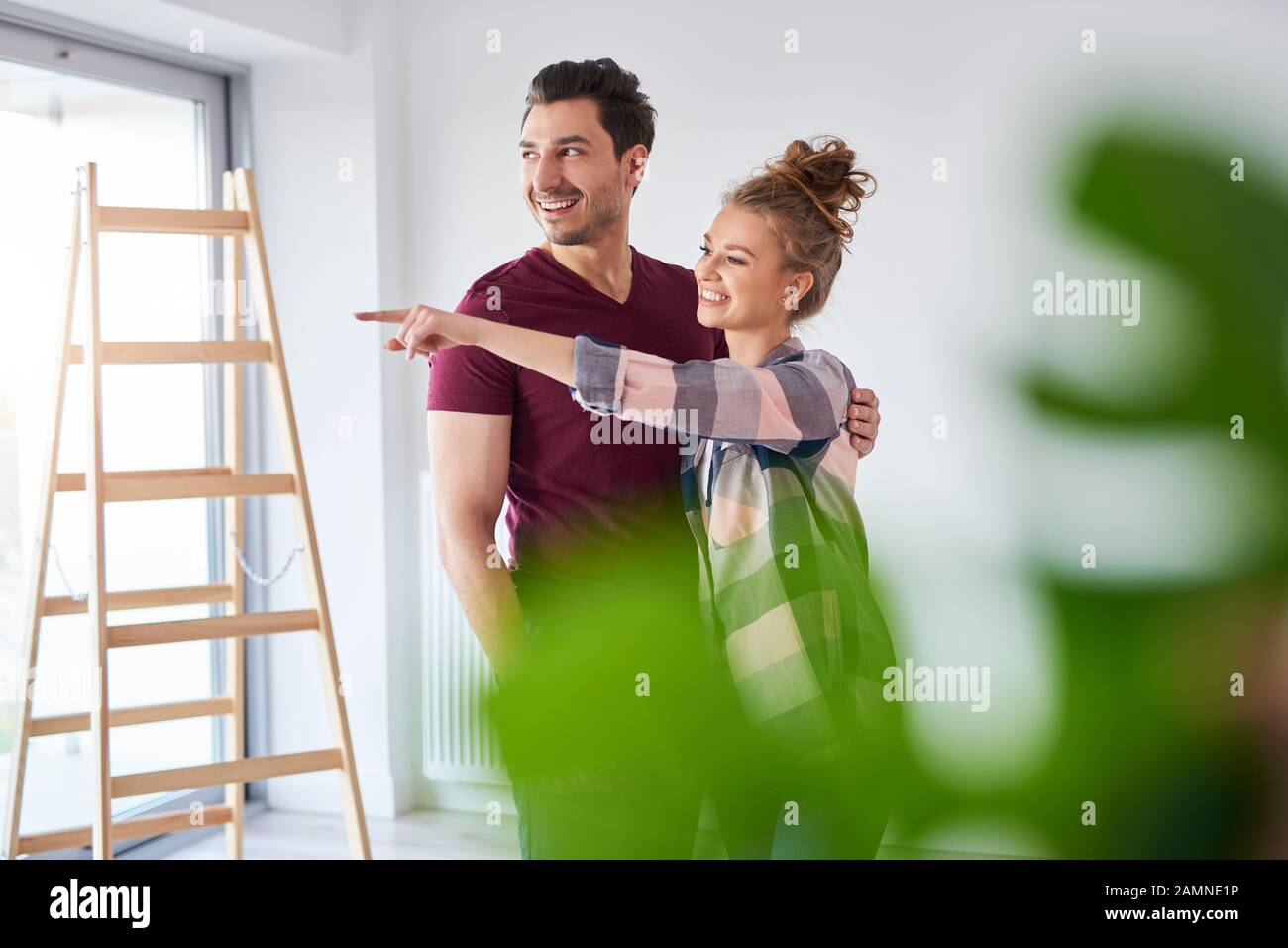 Young couple making plans for home improvement Stock Photo