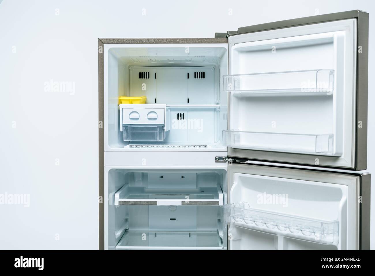 empty open fridge and freezer isolated on white Stock Photo Alamy