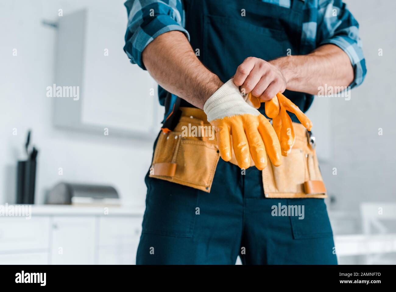 Man Wearing Rubber Gloves High Resolution Stock Photography and Images