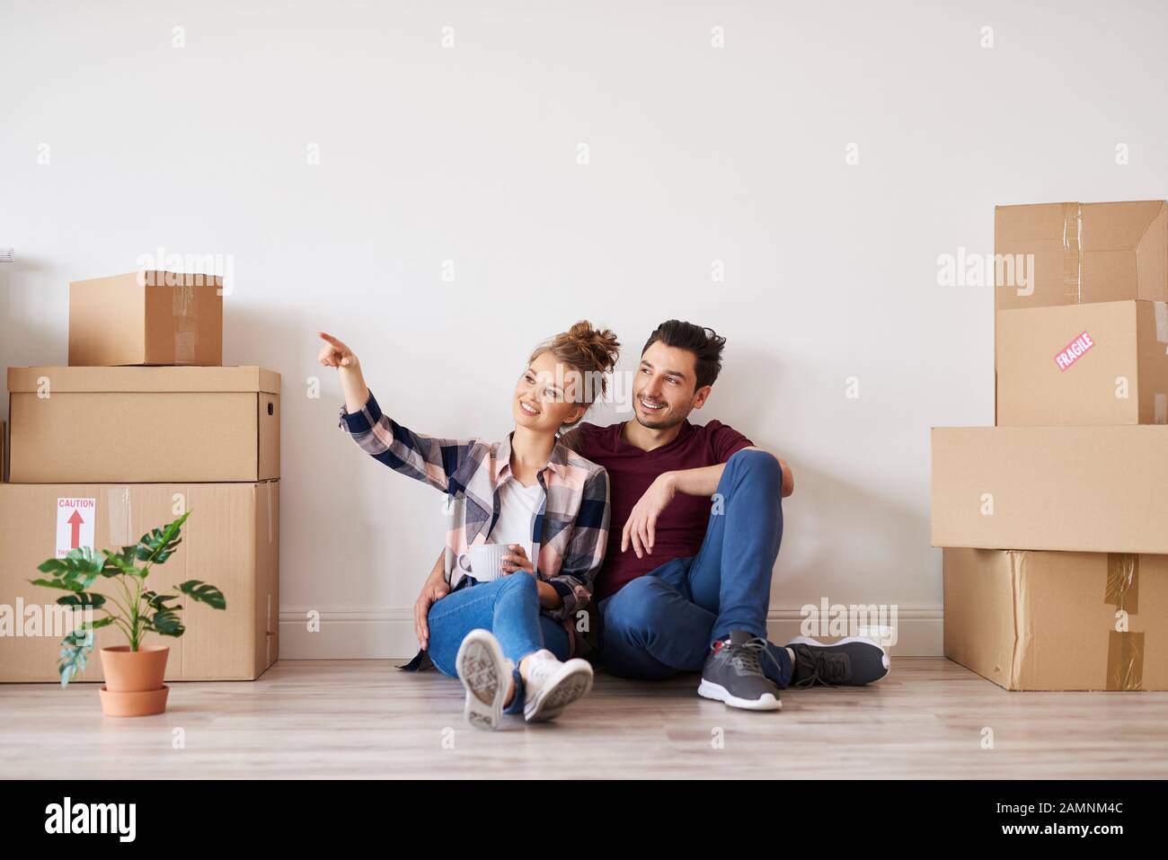 Happy couple making plans for home improvement Stock Photo