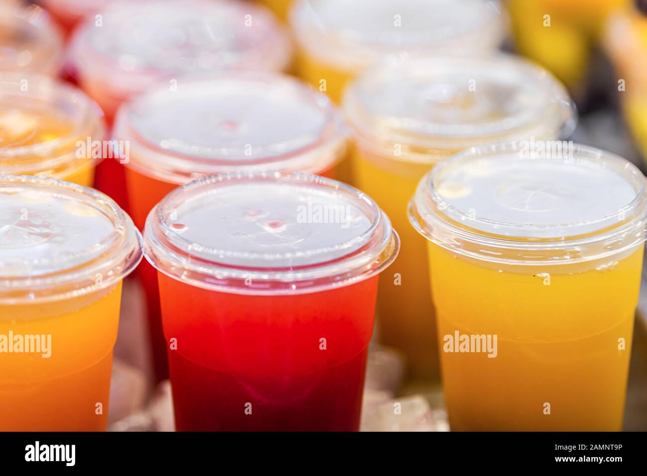 Download Closeup Of Red Yellow Juice Drink Cocktail Plastic Cups Beverages And Cover In Shop Store Counter In Summer Stock Photo Alamy PSD Mockup Templates