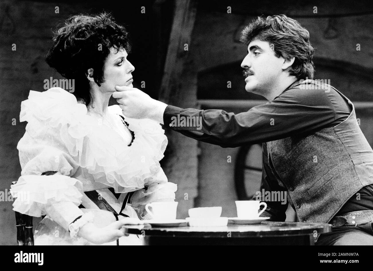 Jill Gascoine (as Frenchy) with Alfred Molina (as Tom Destry) in DESTRY RIDES AGAIN  music & lyrics: Harold Rome  book: Leonard Gershe  based on the 1939 film  design: Ana Jebens  lighting: Andy Phillips  musical staging: Stuart Hopps  director: Robert Walker at the Donmar Warehouse, London WC2  07/10/1982. Gascoine and Molina married in 1986 after meeting in this production. Stock Photo