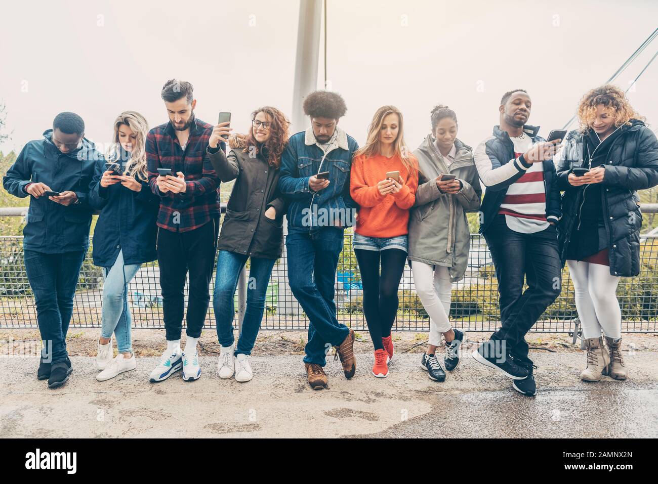 Group of young people staring on their phones Stock Photo