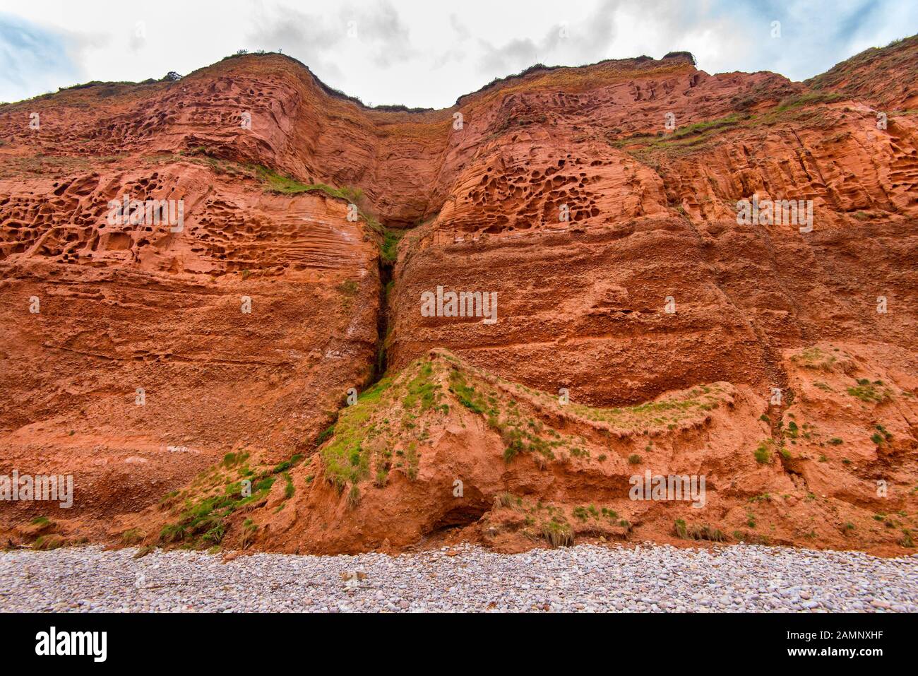 Honeycombe Weathering and Bunter Pebble Beds in the Triassic cliffs to the West of Budleigh Salterton, East Devon, UK Stock Photo