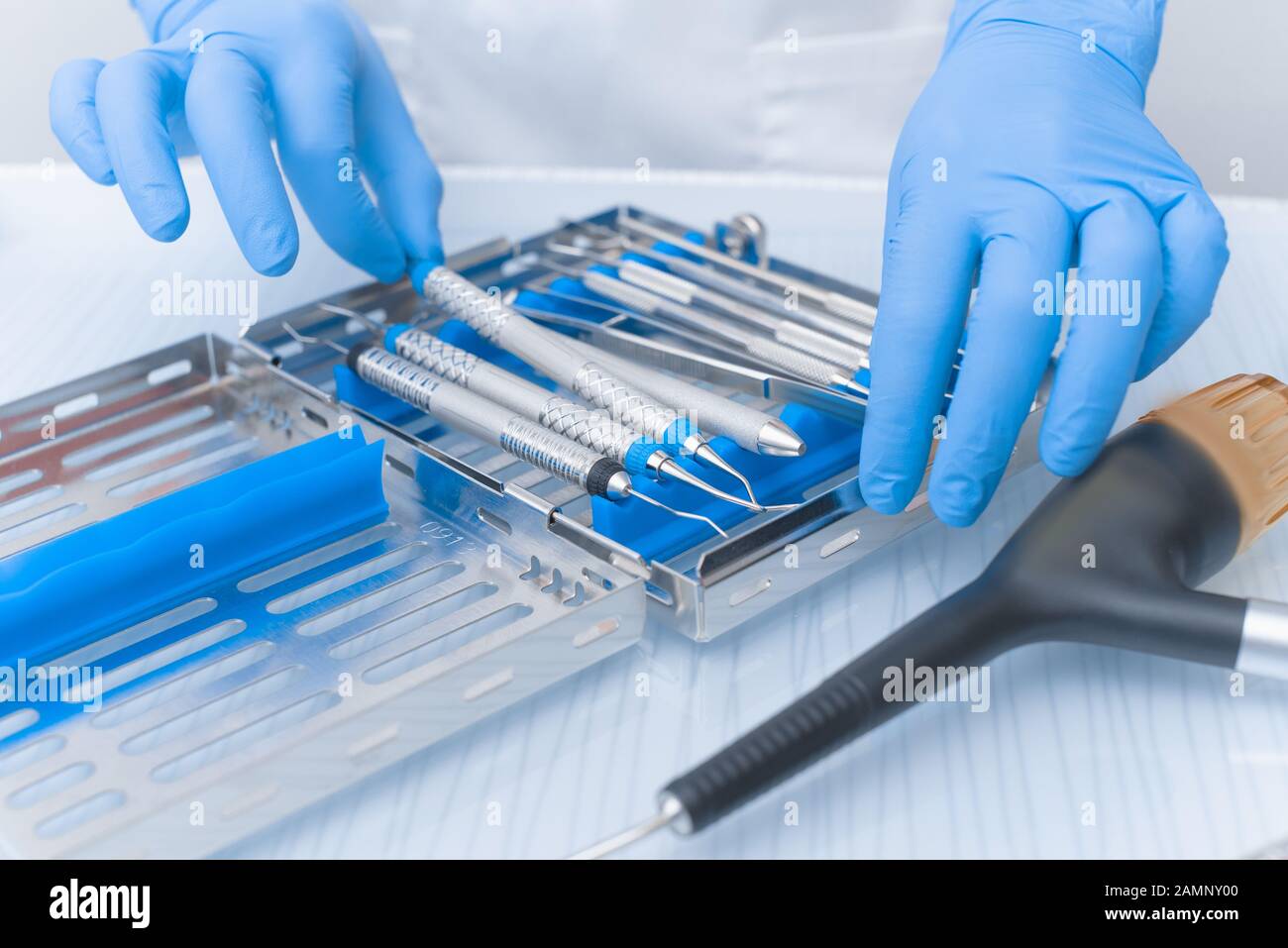 Dental tools in the hands of a doctor close-up. Dentistry Concept. Stock Photo