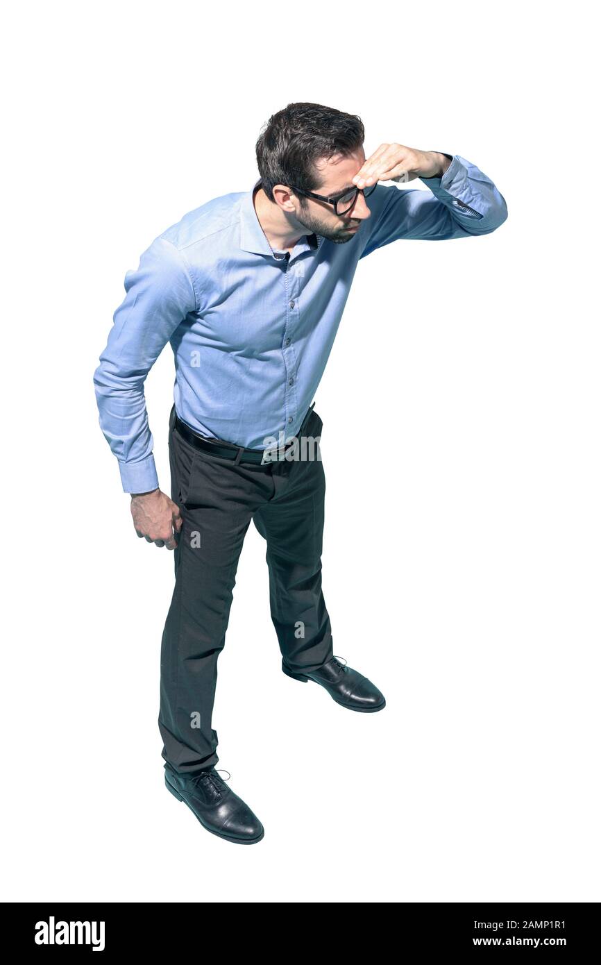 Young businessman bending and looking far away, white background Stock