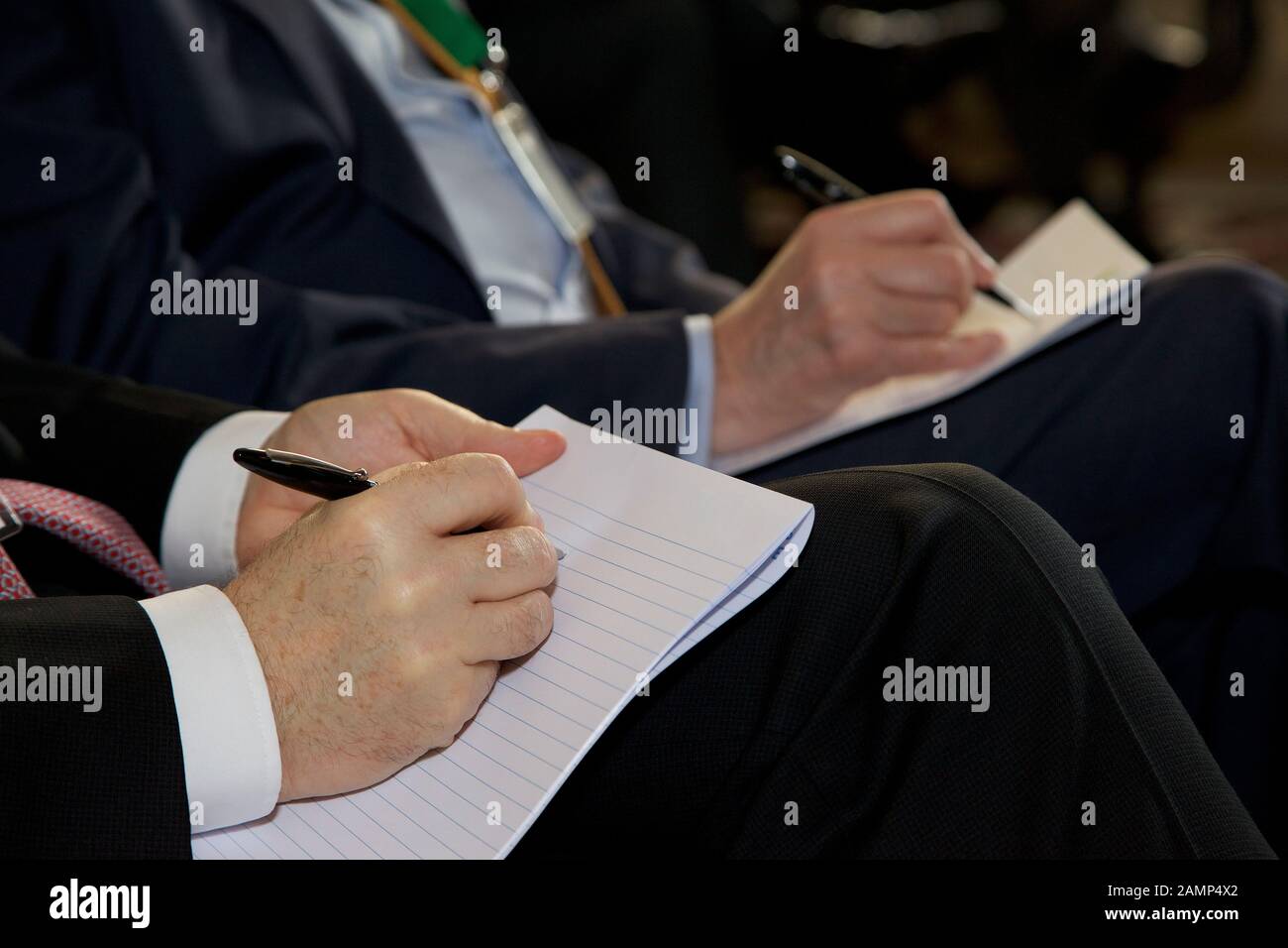 Taking notes at a business meeting or conference. Stock Photo