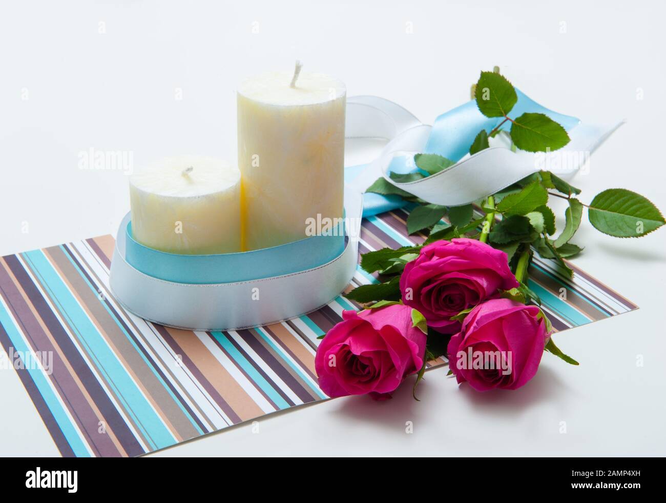 Bouquet of pink roses with candles Stock Photo - Alamy