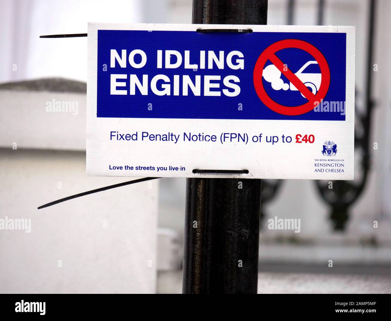 Sign for No Idling Engines tied to a post Stock Photo