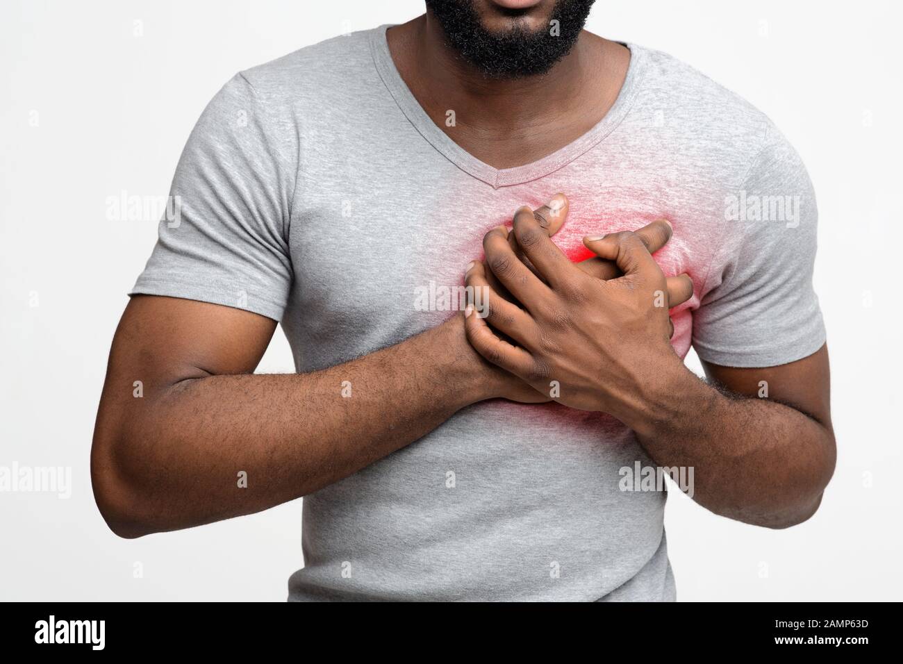 Cropped of young black man having heart attack Stock Photo