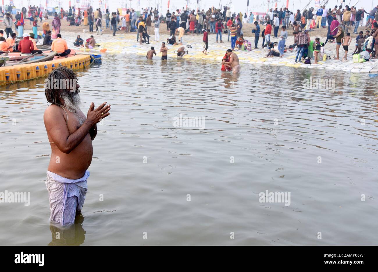 Allahabad, India. 14th Jan, 2020. Allahabad: A sadhu offer prayer after taking holy dip at Sangam, the confluence of three sacred rivers the Yamuna, the Ganges and the mythical Saraswati, during Magh Mela Festival in Prayagraj, Uttar Pradesh state, India, Tuesday, Jan. 14, 2020. (Photo by Prabhat Kumar Verma/Pacific Press) Credit: Pacific Press Agency/Alamy Live News Stock Photo