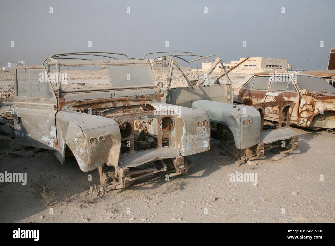 Land rovers on a scrap yard in the middle east Stock Photo