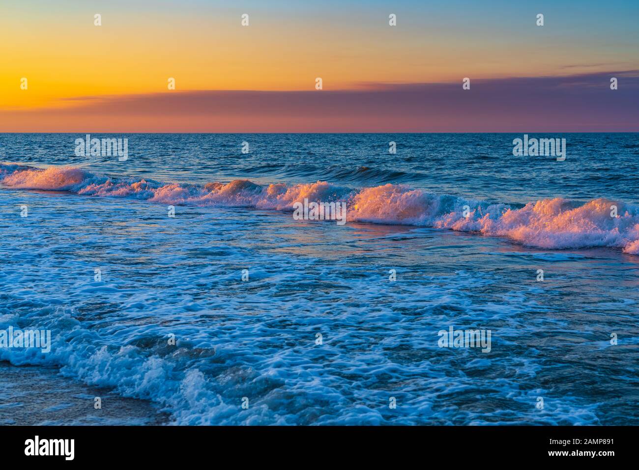 Sea beach in sunset colors Stock Photo