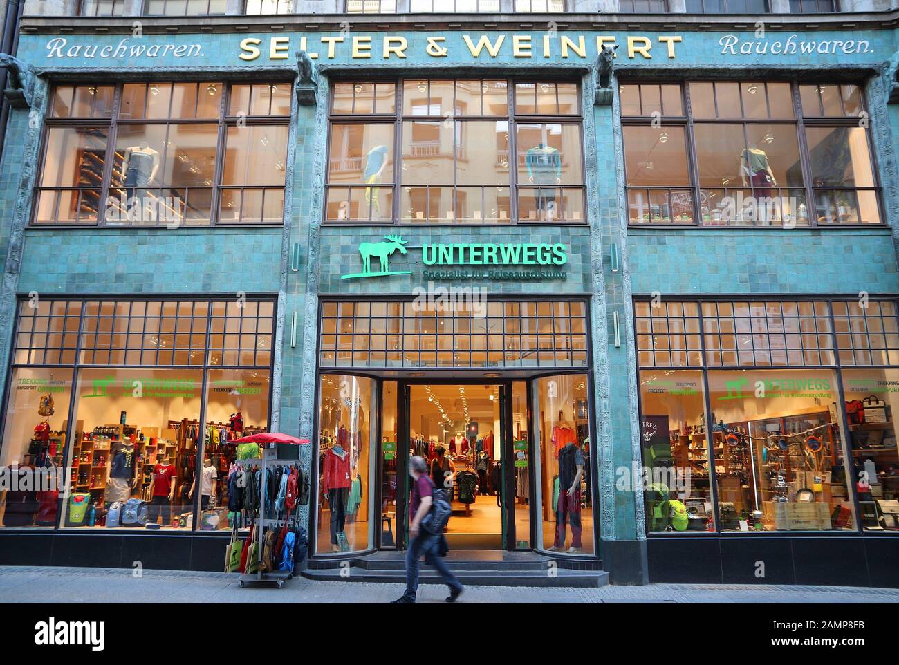 LEIPZIG, GERMANY - MAY 9, 2018: People shop at Unterwegs shop at Nikolai Street (Nikolaistrasse) in Leipzig, Germany. Leipzig is the 10th biggest city Stock Photo