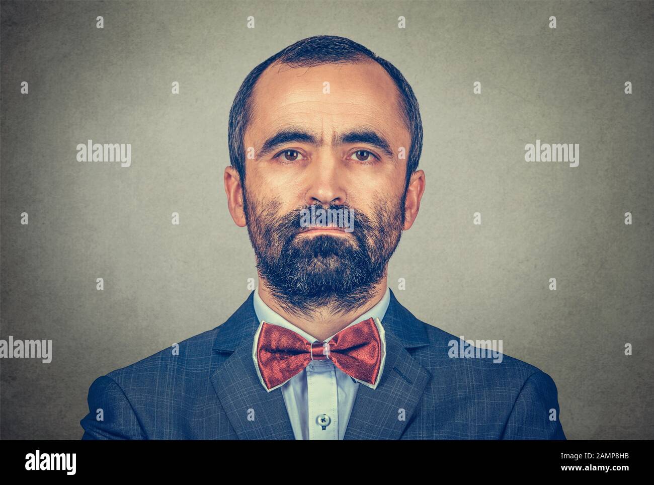 portrait of handsome hipster mature businessman with beard looking at you with serious and confident face expression. Mixed race bearded model isolate Stock Photo