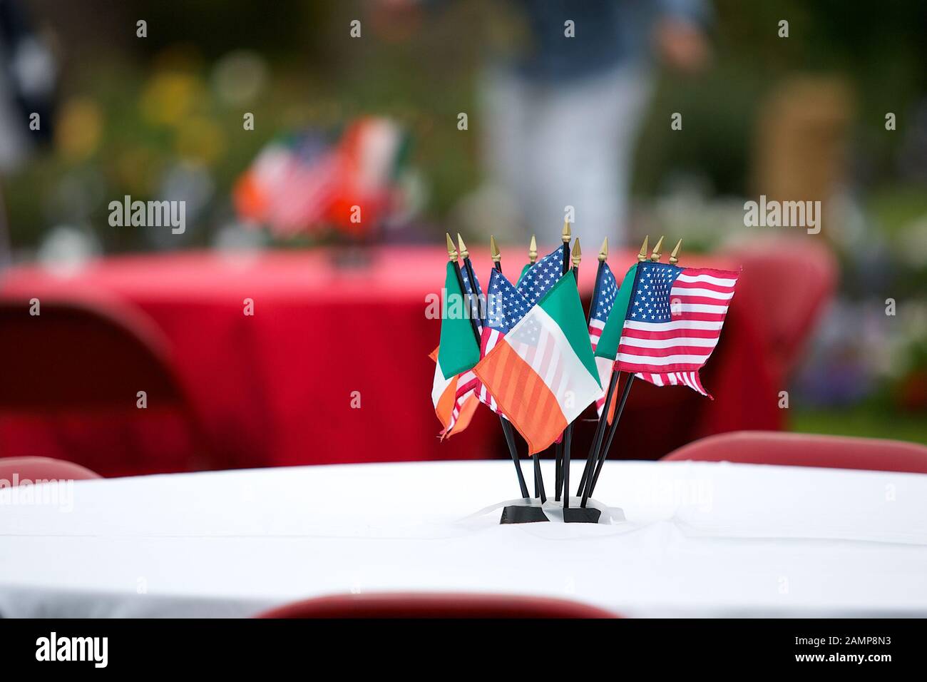 Miniature Irish and American flags used as a table decoration at a 4th of July party. Stock Photo