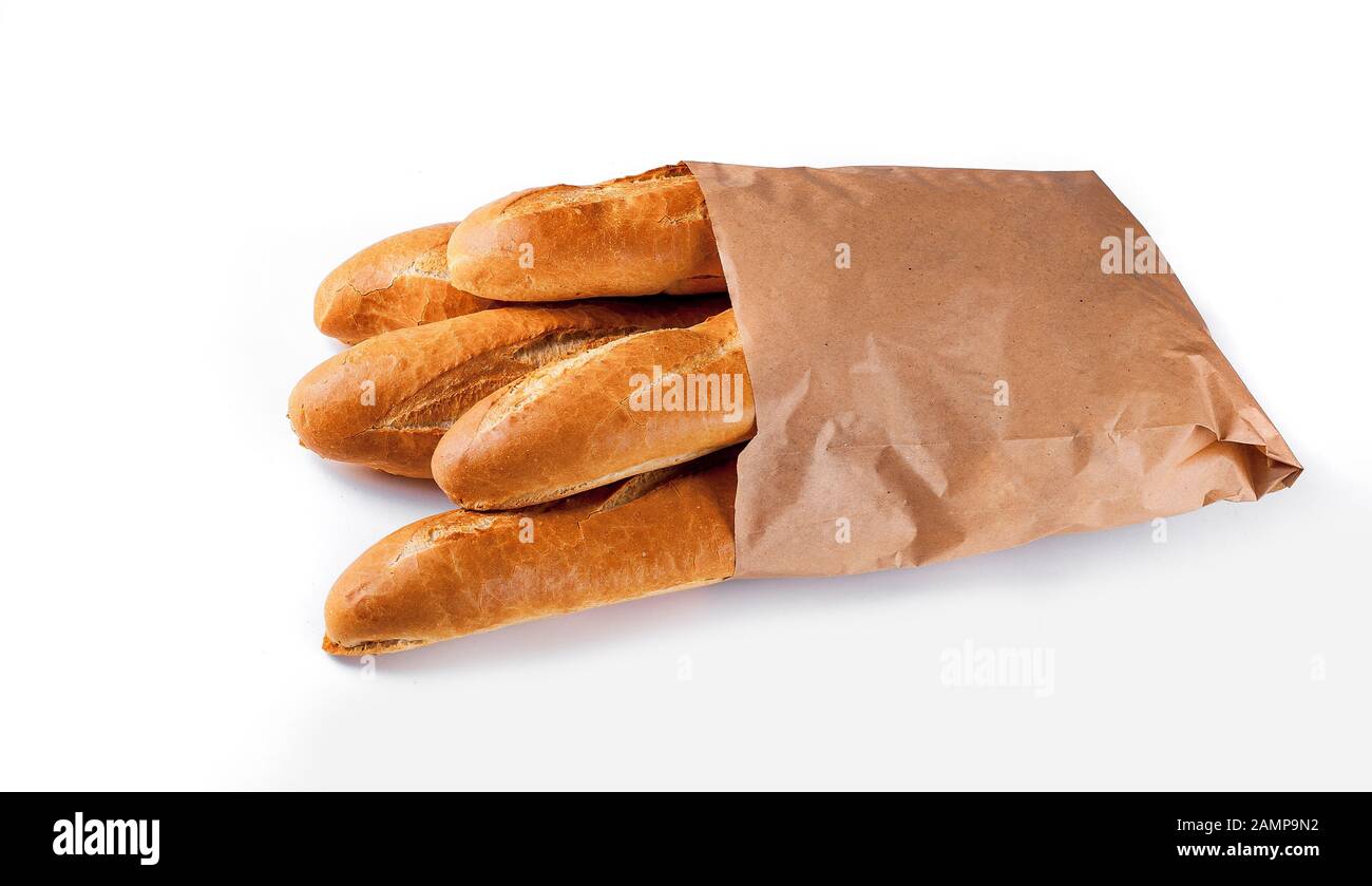 Baguette bread in paper bag on white background Stock Photo - Alamy