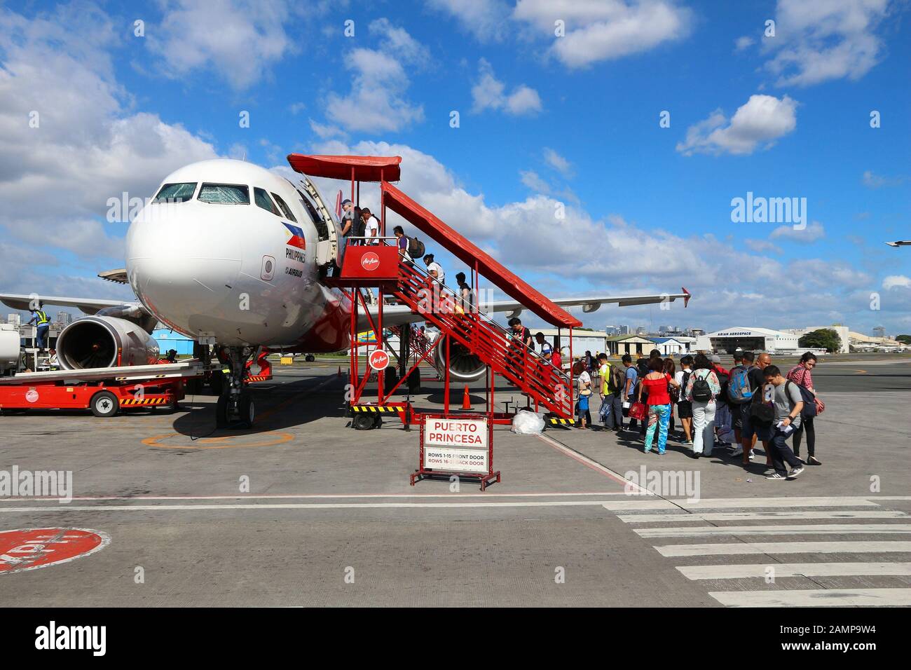 MANILA, PHILIPPINES - NOVEMBER 28, 2017: Passengers board Air Asia Airbus A320 at Ninoy Aquino International Airport (NAIA), Manila. The airport handl Stock Photo