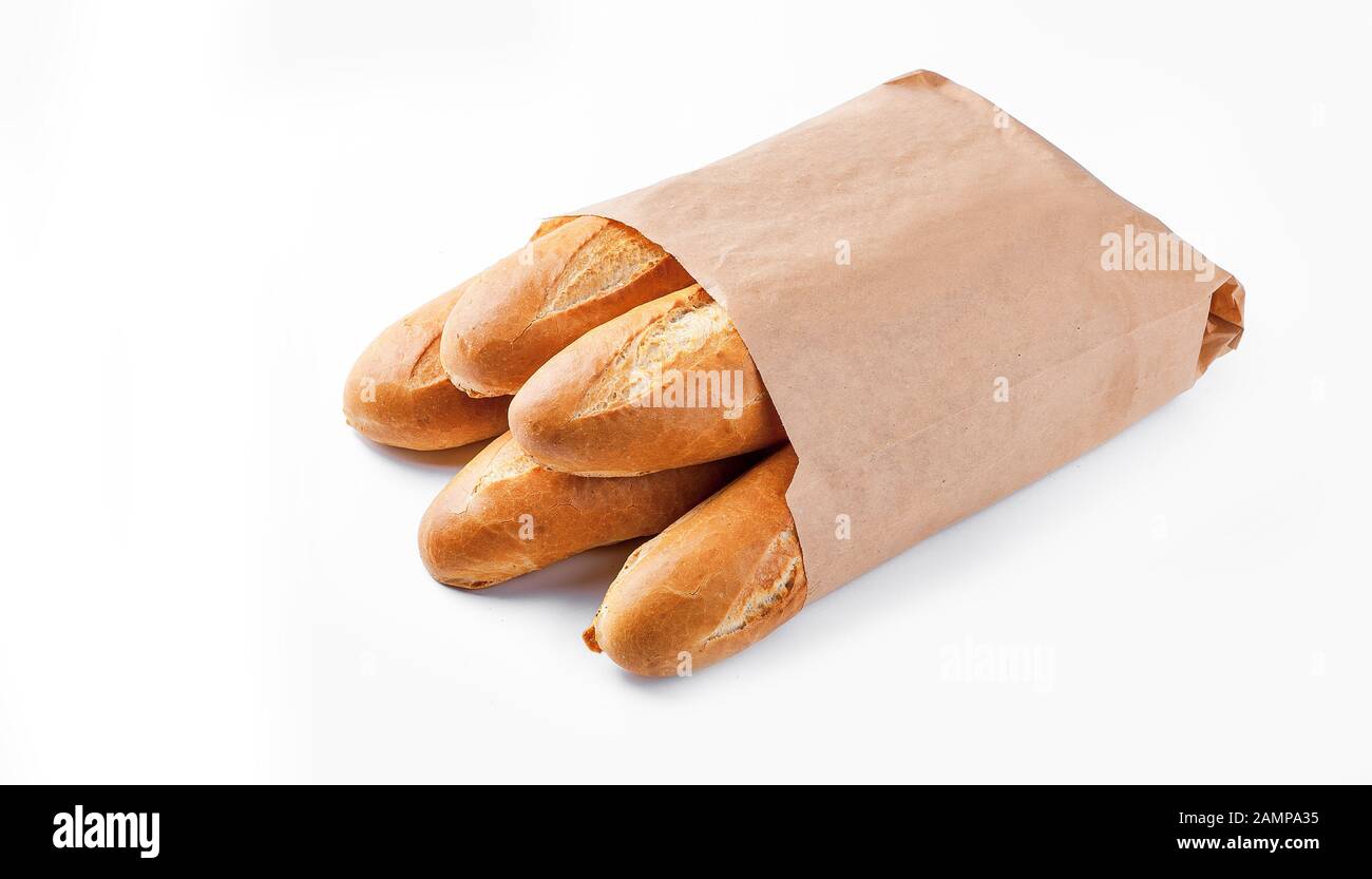 Baguette bread in paper bag on white background Stock Photo - Alamy