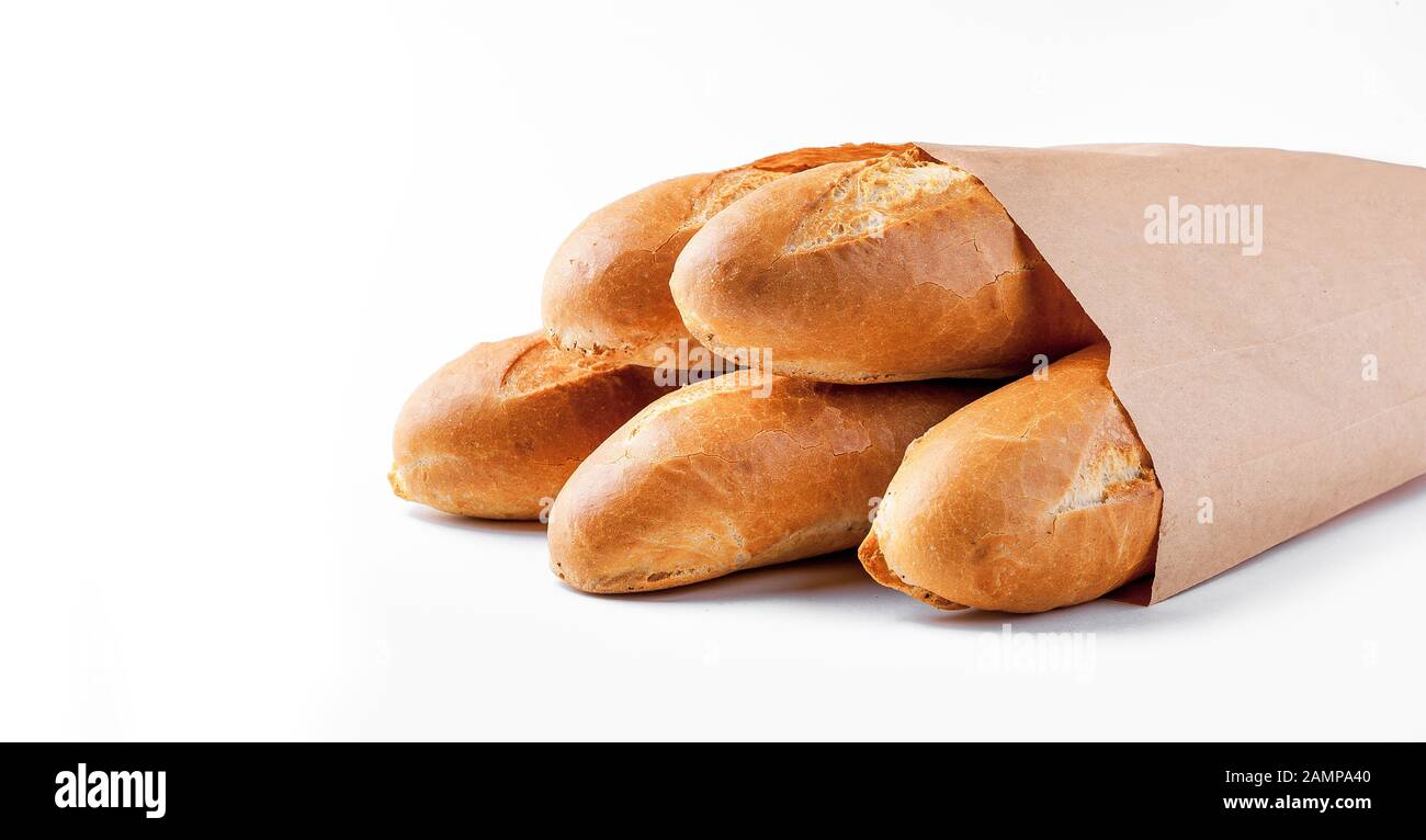 Baguette bread in paper bag on white background Stock Photo - Alamy