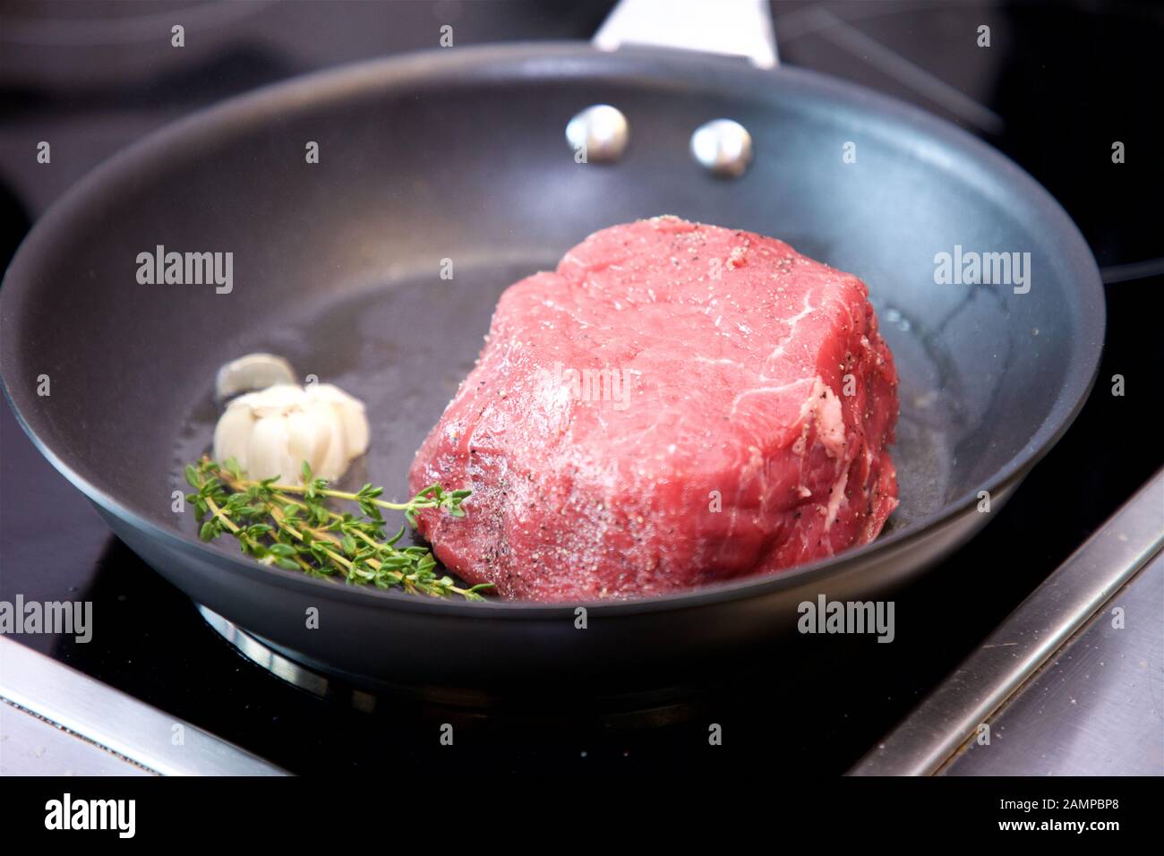 Cooking Fillet Beef Steak with Garlic and Thyme Stock Photo Alamy